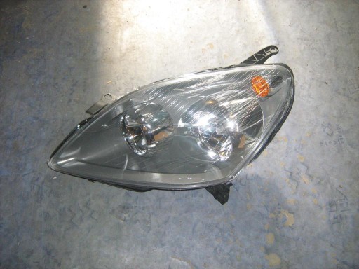 REFLEKTOR ZAFIRA B 2005-2008r LEWY NOWY TYC